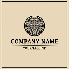 Elegant black mandala logo design on beige background, featuring company name and tagline.