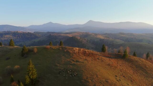 Gorgeous bird's eye view of distant mountains and hilly countryside in the morning light. Filmed in UHD 4k video.