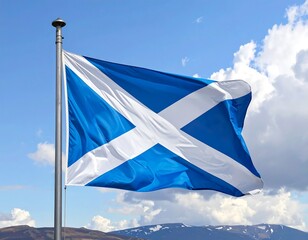 The national flag of Scotland flapping on a pole against sky background