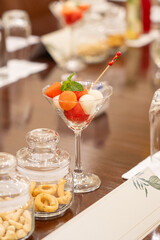 Watermelon and feta salad being served in a martini glass in a boardroom conference