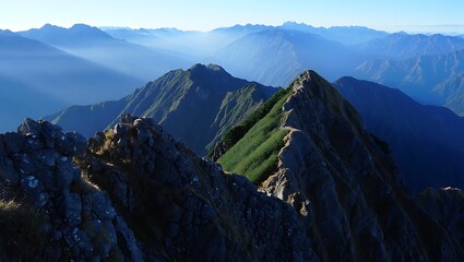 Breathtaking mountain landscape with layers of blue hazy peaks far away