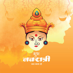 A stunning and artistic illustration of the serene face of Goddess Durga with ornate headgear, celebrating the Hindu festival of Navratri against a vibrant orange and yellow watercolor background.