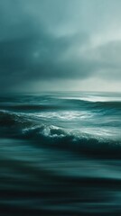 Fototapeta premium Moody seascape with turbulent waves rolling under a dark, brooding sky, capturing the raw power and melancholic beauty of an ocean in motion