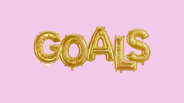 Goal message in foil balloon golden words on pink background