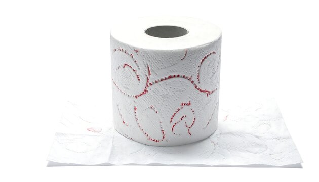 White toilet paper roll with decorative red patterns