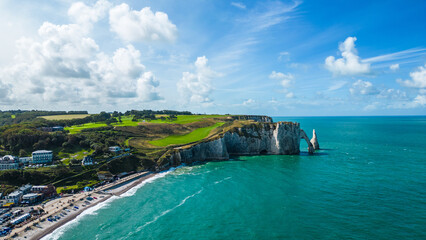 Aerial view of Etretat cliffs on the Normandy coast in France, with dramatic white chalk formations, natural arches, and the deep blue sea, a famous landmark for nature, travel, and adventure photo