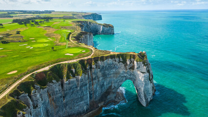 Aerial view of Etretat cliffs on the Normandy coast in France, with dramatic white chalk formations, natural arches, and the deep blue sea, a famous landmark for nature, travel, and adventure photo © Viktor