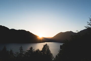 sunset over mountains at lake cushman, washington, pacific northwest