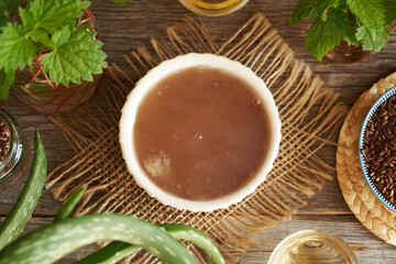 Homemade flax seed gel, aloe vera leaves, argan oil, apple cider vinegar - ingredients for natural diy shampoo. Alternative haircare, no poo.