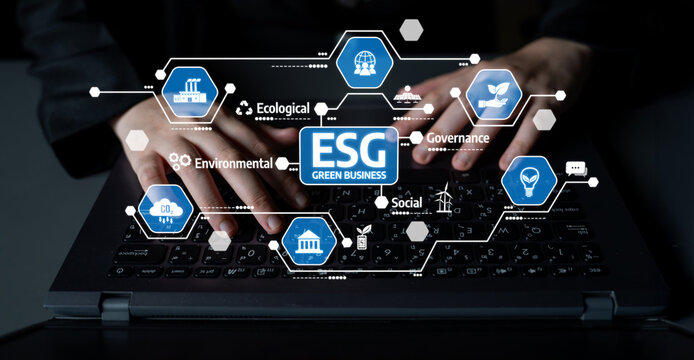 Close-up view of hands typing on a laptop keyboard surrounded by ESG icons, illustrating the principles of sustainability and responsible business practices. Tessel