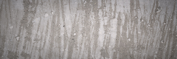 Texture of old concrete wall. Rough, stained concrete surface. Wide panoramic background for design.