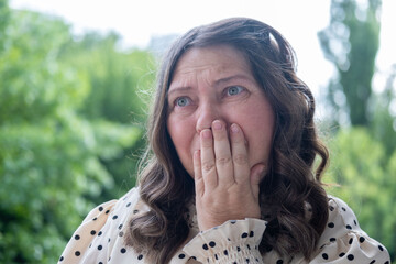 Elderly Sad woman in emotional pain crying alone showing vulnerability and sadness, sorrow...