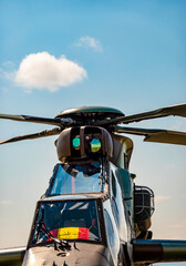 A close-up view of the main rotor of a military helicopter