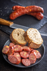 Sliced smoked ​​sausage on plate