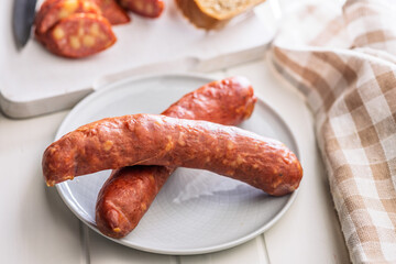 Sliced smoked ​​sausage on plate