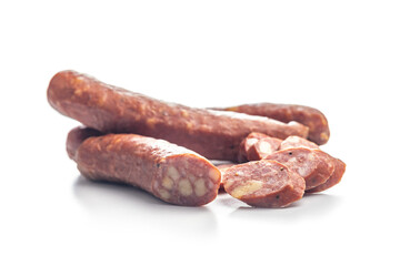 Sliced smoked ​​sausage isolated on white background.