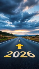 A scenic highway stretches into the horizon under a dramatic sky, marked with the year "2026," symbolizing hope and future journeys.