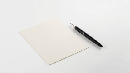 Pen and Blank Paper on a White Background