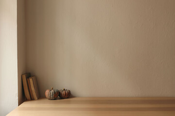 Autumn interior still life. Scandinavian living room, home office. Pumpkins, old books on table,...