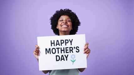 Happy mother's day: african american woman holding sign in slow motion