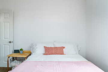 Bedroom white pink chenille pillow, throw blanket, side table basket