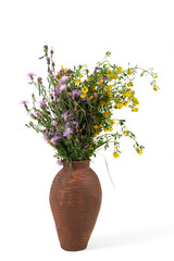 Handmade ceramic vase with a bouquet isolated on white background.