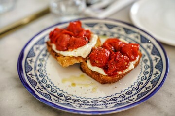 Toast with cheese and roasted tomatoes