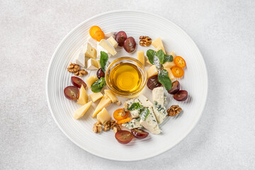 Cheese platter with honey and fruits