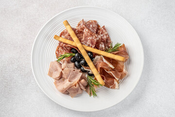 Italian antipasto with cured meats and olives