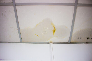 Water Stain on Ceiling from Rain Leak and Roof Damage
