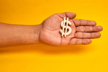 A hand holding a dollar symbol represents financial stewardship and funding readiness, illustrating...