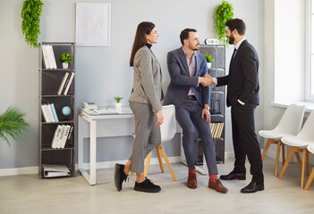 Handshake of client and lawyer, agent advisor in office. Business people shake hands to promise success of contract and deal, purchase, start cooperation. Partnership, collaboration, agreement concept