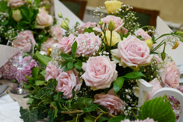 Decoration of a natural bouquet of flowers and the inscription in English Love in the middle.