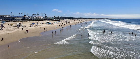 Pismo Beach as seen from a UAV Drone with the eaves and people enjoying the day as the waves hit...