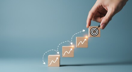 Achieving business goals with strategic planning and step-by-step growth, visualized on wooden blocks