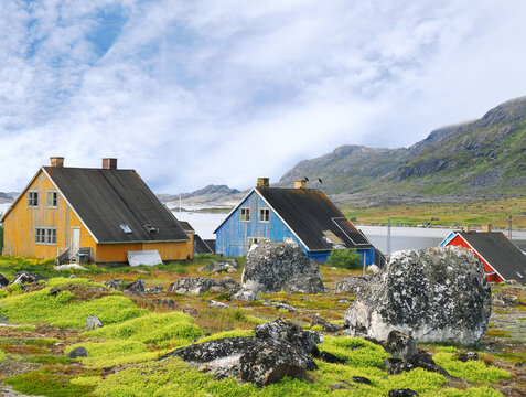 The Colorful Houses and Rugged Landscape of Nanortalik, Greenland on a Beautiful Summer Day