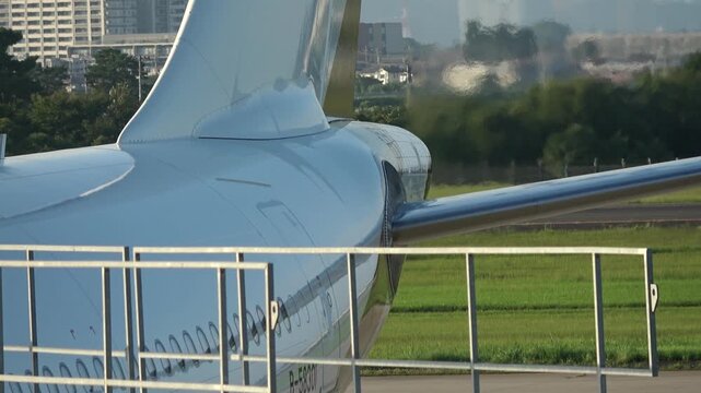 Starlux Airlines' A330 is on the tarmac, with ripples of heat coming off its engines, Sendai, Japan, 2025.09.16.