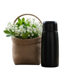 A black thermos bottle next to a burlap basket filled with small white flowers, isolated on transparent background