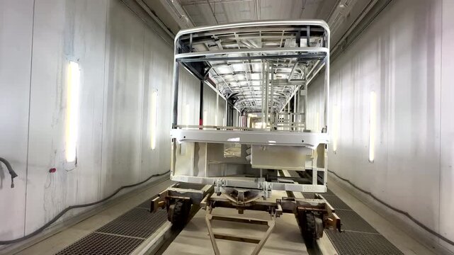 Spray paint shop for Bus. Bus Paint Booth Painting Chamber For automotive industry. City bus Paint Both. Inside of buses assembly plant, paint shop. Automotive workshop production. Bus manufacturing.