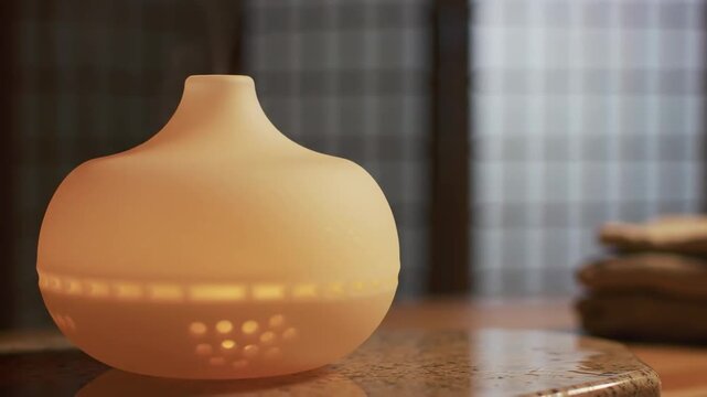 Aroma diffuser with warm ambient light for home relaxation and wellness therapy in a tranquil spa setting