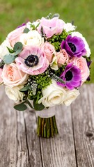 Delicate floral bouquet on weathered wood