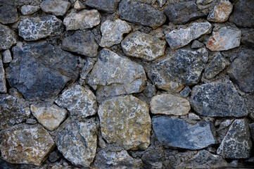 Rough natural stone wall background texture