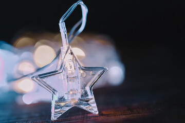 .Macro Shot of Star Christmas Light Decoration.Illuminated Star Christmas Ornament Decoration.Holiday Light Decoration. 