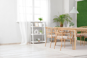 Interior of dining room with green houseplants