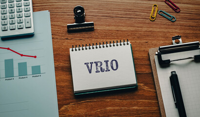There is notebook with the word VRIO. It is an abbreviation for Value, Rarity, Inimitability, Organization as eye-catching image.