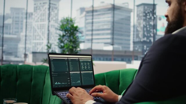 Determined CEO works in office analyzing infographics and setting business goals to drive corporate growth, global investment strategy in a competitive environment. Leadership skills. Camera A.