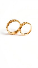 Generative AI depicts two intertwined ornate gold rings a symbol of union.