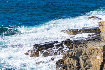waves crashing on rocks
