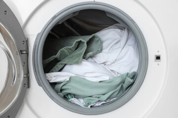 Bed sheets in washing machine, closeup