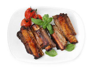 Roasted beef ribs, tomatoes and basil isolated on white, top view